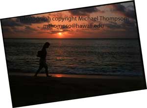 girl-walks-by-sunset-beach.jpg